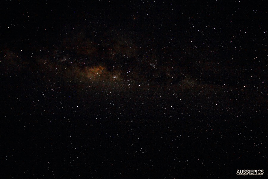 Looking out along the galactic plane, or straight up, depending on your point of view.