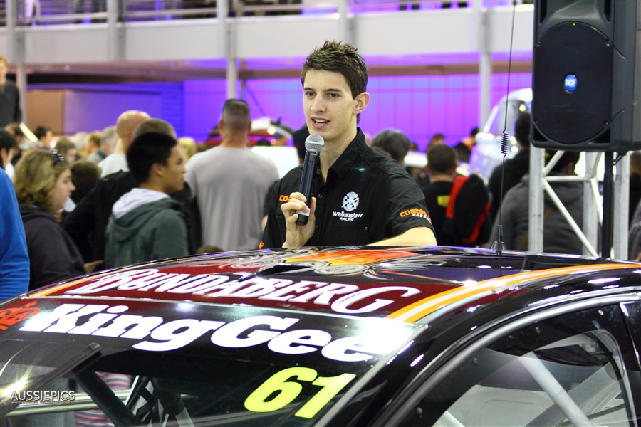 Nick Percat from Walkinshaw racing, leaning on what I doubt is Fabian Coulthards car since the motorshow and the Townsville V8 Supercars event cross timeslots.