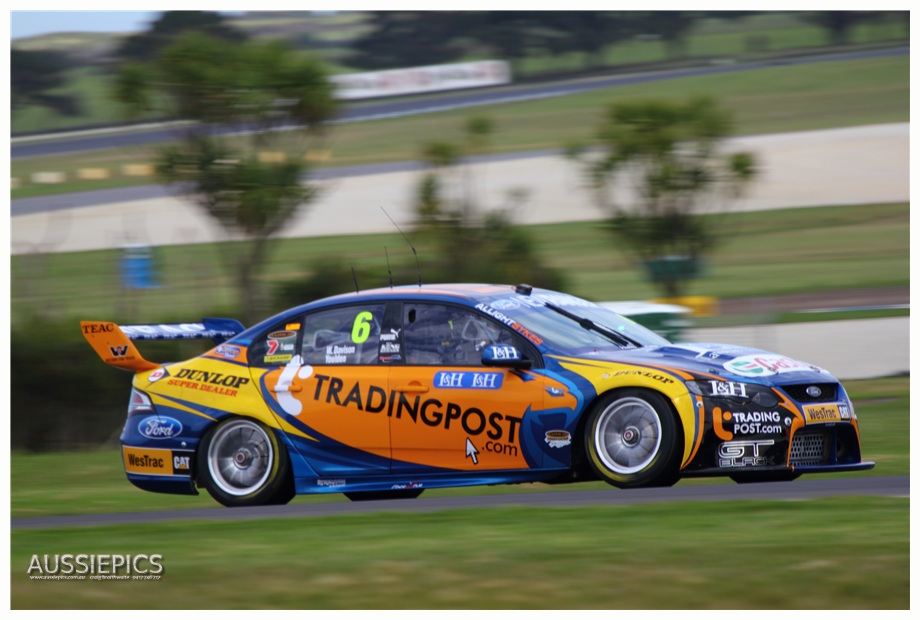 v8 Supercar shots from Phillip Island : Pole sitter for the Sunday race is Will Davison and his car 'Kate', Here his co-drive Luke Youlden goes past